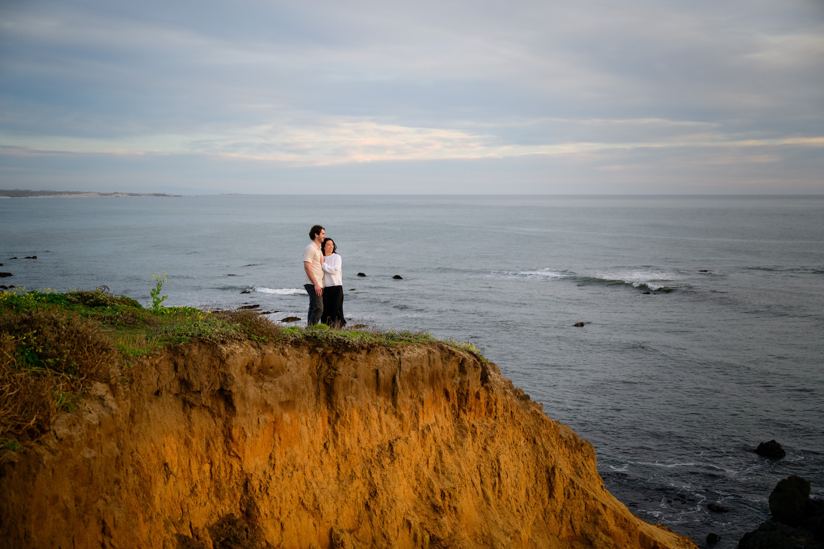 Malia and Jayson on the bluff above the Pacific